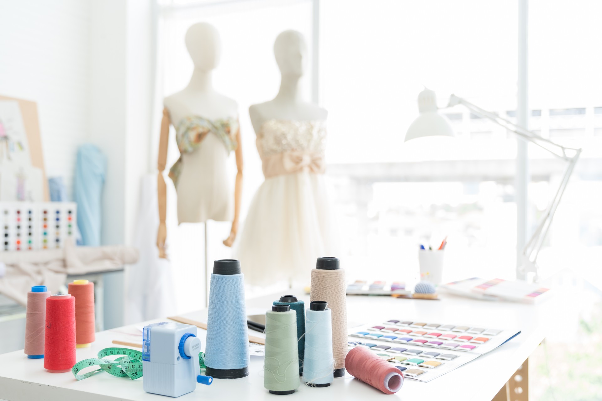 Tailor shop. Dummy mannequin with hanging measuring tape with fashion design in tailor shop. garment, design, fashion, dressmaking concept